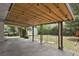 Covered patio perfect for outdoor entertaining, featuring a string of lights and a view of the backyard at 4425 S Zang St, Morrison, CO 80465