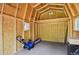The interior of the storage shed with wood construction and ample room for storing equipment and tools at 4425 S Zang St, Morrison, CO 80465