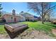 Spacious backyard featuring a large lawn, mature trees, and raised garden bed at 5775 S Pagosa Way, Centennial, CO 80015