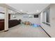 Basement rec room featuring a large sofa and play area at 5775 S Pagosa Way, Centennial, CO 80015