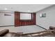 Spacious basement featuring a large home theater with custom wood cabinetry at 5775 S Pagosa Way, Centennial, CO 80015
