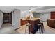 Basement bar area with counter seating, a tiled backsplash, and a modern sink at 5775 S Pagosa Way, Centennial, CO 80015