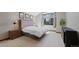 Calm bedroom with large window, wood nightstand, and stylish decor creates a peaceful retreat at 5775 S Pagosa Way, Centennial, CO 80015