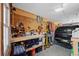 Organized garage with workbench, tool storage, and car parking at 5775 S Pagosa Way, Centennial, CO 80015