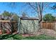 The backyard features a practical garden shed for extra storage on a brick base at 5775 S Pagosa Way, Centennial, CO 80015
