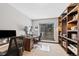 Dedicated home office with built-in shelves, a work desk, and a comfortable chair, offering a productive workspace at 5775 S Pagosa Way, Centennial, CO 80015
