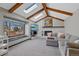 Bright living room with fireplace, beamed ceilings, large window and skylights at 5775 S Pagosa Way, Centennial, CO 80015