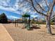 Community playground with slides, climbing structures, and soft landing surfaces at 5775 S Pagosa Way, Centennial, CO 80015
