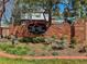 Elegant brick community entrance sign, surrounded by landscaped gardens at 5775 S Pagosa Way, Centennial, CO 80015