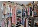 The walk-in closet provides an abundance of hanging storage and shelving at 5775 S Pagosa Way, Centennial, CO 80015