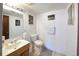 Bathroom featuring a sink, mirror, toilet and tile floors at 530 S Laredo Cir, Aurora, CO 80017