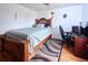 Bedroom featuring a bed, desk, ceiling fan and hardwood floors at 530 S Laredo Cir, Aurora, CO 80017