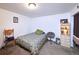 A simply decorated bedroom includes a cozy bed and storage cabinet at 530 S Laredo Cir, Aurora, CO 80017