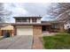 Charming two-story home featuring a brick facade, attached garage and a well-maintained front yard at 530 S Laredo Cir, Aurora, CO 80017
