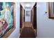 Hallway with wood floors and art on the wall at 530 S Laredo Cir, Aurora, CO 80017