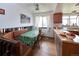 Cozy kitchen area featuring a wood-topped peninsula, seating, and a view into an adjacent breakfast nook at 530 S Laredo Cir, Aurora, CO 80017