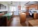 Functional kitchen featuring wood cabinets, breakfast nook, and a large window for natural light at 530 S Laredo Cir, Aurora, CO 80017