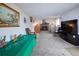 Spacious living room featuring a brick fireplace and carpeted floors for comfort and style at 530 S Laredo Cir, Aurora, CO 80017