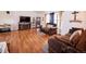 Spacious living room with hardwood floors, fireplace, entertainment center, and comfortable sofas at 530 S Laredo Cir, Aurora, CO 80017