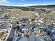 An aerial shot showcases a suburban community with townhomes and open space at 726 Vista Verde Hts, Monument, CO 80132