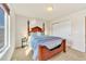 Bright bedroom featuring a four-poster bed, soft carpet, a side table, and a closet offering ample storage space at 726 Vista Verde Hts, Monument, CO 80132