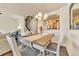 Dining area with stylish table set and open view of the modern kitchen at 726 Vista Verde Hts, Monument, CO 80132