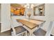 Bright dining area with a view into the modern kitchen area at 726 Vista Verde Hts, Monument, CO 80132