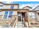 Charming front entrance featuring a stone facade, well-lit doorway, and inviting stairs leading to the home at 726 Vista Verde Hts, Monument, CO 80132