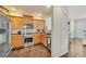 Well-lit kitchen featuring stainless steel appliances and warm wood cabinetry at 726 Vista Verde Hts, Monument, CO 80132