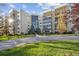 Beautiful exterior view of a well-maintained condominium complex with lush landscaping and inviting entrance at 13631 E Marina Dr # 201, Aurora, CO 80014