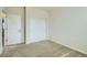 Neutral bedroom features include a double sliding door closet and white interior doors at 10057 Granby St, Commerce City, CO 80022