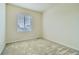 Bedroom with neutral carpet, a window, and plenty of natural light at 10057 Granby St, Commerce City, CO 80022