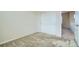 Neutral bedroom with sliding closet doors and carpet floors, offering a blank canvas at 10057 Granby St, Commerce City, CO 80022