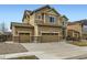 Attractive home with a three-car garage, complemented by well-kept landscaping at 10057 Granby St, Commerce City, CO 80022