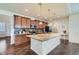 Modern kitchen with a large island, granite countertops, and stainless steel appliances at 10057 Granby St, Commerce City, CO 80022