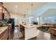 Open kitchen with a large island, seamlessly connected to the living room at 10057 Granby St, Commerce City, CO 80022