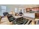 Spacious living area with hardwood floors, perfect for entertaining and everyday living at 10057 Granby St, Commerce City, CO 80022