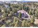 Stunning aerial view of a home with lush greenery and a circular driveway at 24140 Us Highway 40, Golden, CO 80401