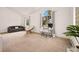Spacious bedroom with a desk, comfortable seating, and large windows at 24140 Us Highway 40, Golden, CO 80401