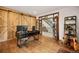 Office space with an accent wood wall, desk, and views of the property at 24140 Us Highway 40, Golden, CO 80401