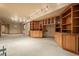 Finished basement with built-in shelving and cabinets at 18981 E Belleview Pl, Centennial, CO 80015