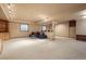 Finished basement with a sitting area and large space at 18981 E Belleview Pl, Centennial, CO 80015