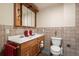 Basement bathroom with double vanity and tile flooring at 18981 E Belleview Pl, Centennial, CO 80015