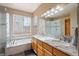 Bathroom with a double vanity and large shower at 18981 E Belleview Pl, Centennial, CO 80015