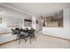 Bright dining area with a table and chairs, and a large mirror at 18981 E Belleview Pl, Centennial, CO 80015