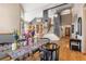 Elegant dining room with hardwood floors and a view of the grand staircase at 18981 E Belleview Pl, Centennial, CO 80015