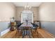 Cozy dining area with hardwood floors and a charming chandelier at 18981 E Belleview Pl, Centennial, CO 80015