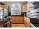 Kitchen features stainless steel appliances and wood cabinets at 18981 E Belleview Pl, Centennial, CO 80015