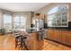 Spacious kitchen with island, stainless steel appliances, and hardwood floors at 18981 E Belleview Pl, Centennial, CO 80015