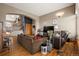 Spacious living room featuring hardwood floors and a cozy seating area at 18981 E Belleview Pl, Centennial, CO 80015